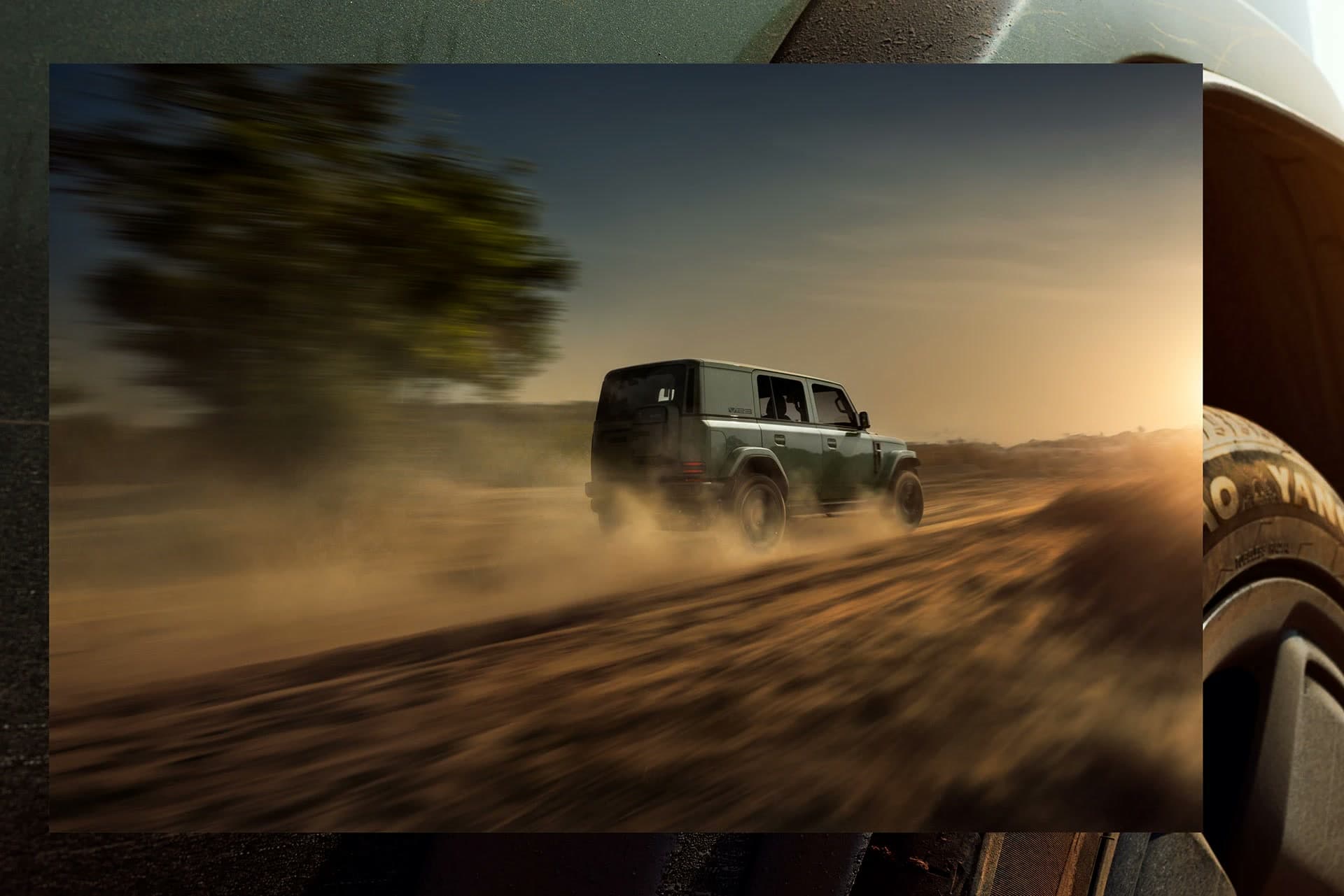 iCAUR V23 driving through dust on an outdoor trail